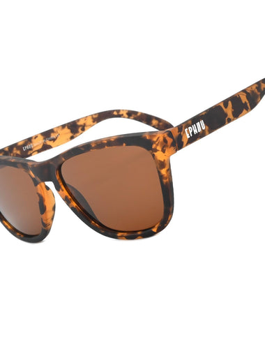 Sunglasses with tortoiseshell frame and brown lenses on a white background